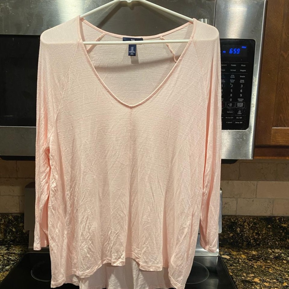 Pink three-quarter length, V-neck shirt
